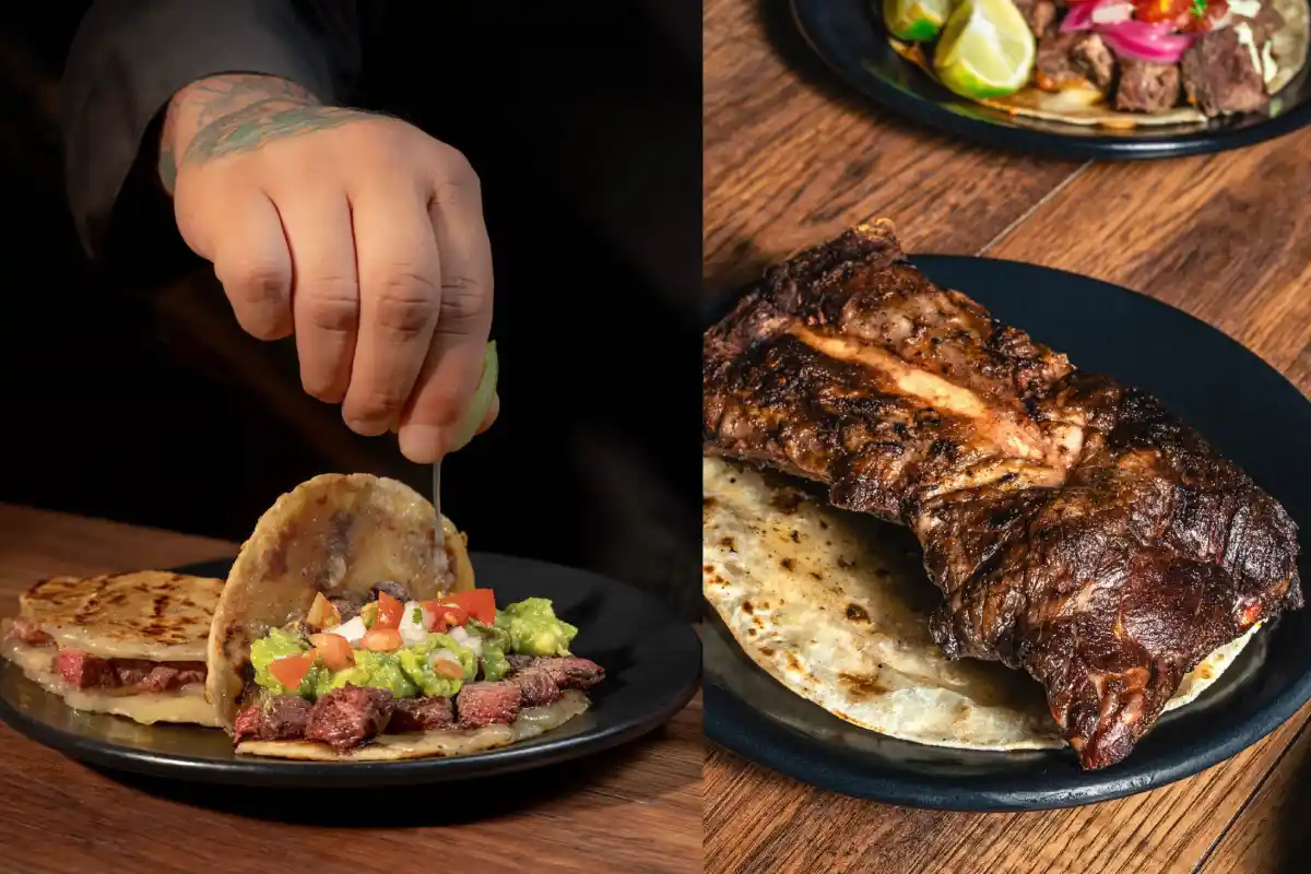 Mano de hombre añadiendo unas gotas de limón a un taco de carne asada